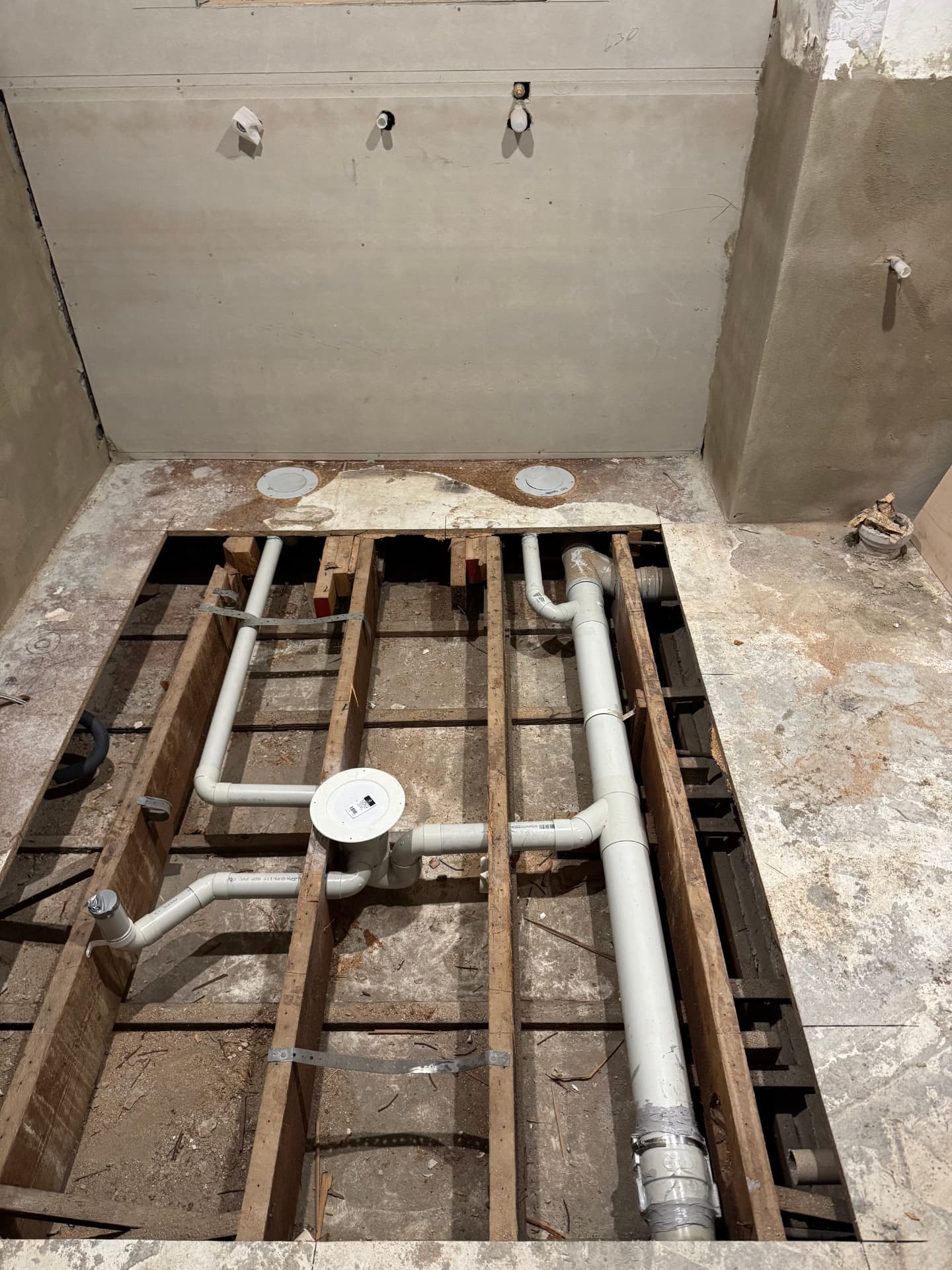 New DWV drainage pipework laid between floor joists during a Sydney bathroom renovation stack alteration
