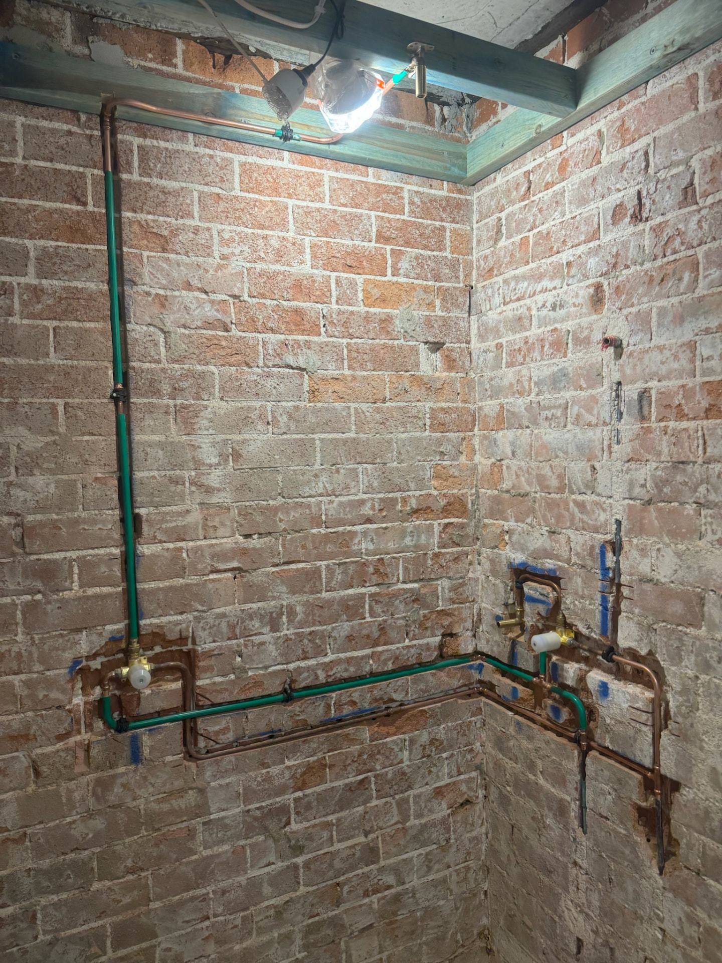 Copper hot, cold and gas rough-in chased into brick walls with tempering valve during a Sydney construction project