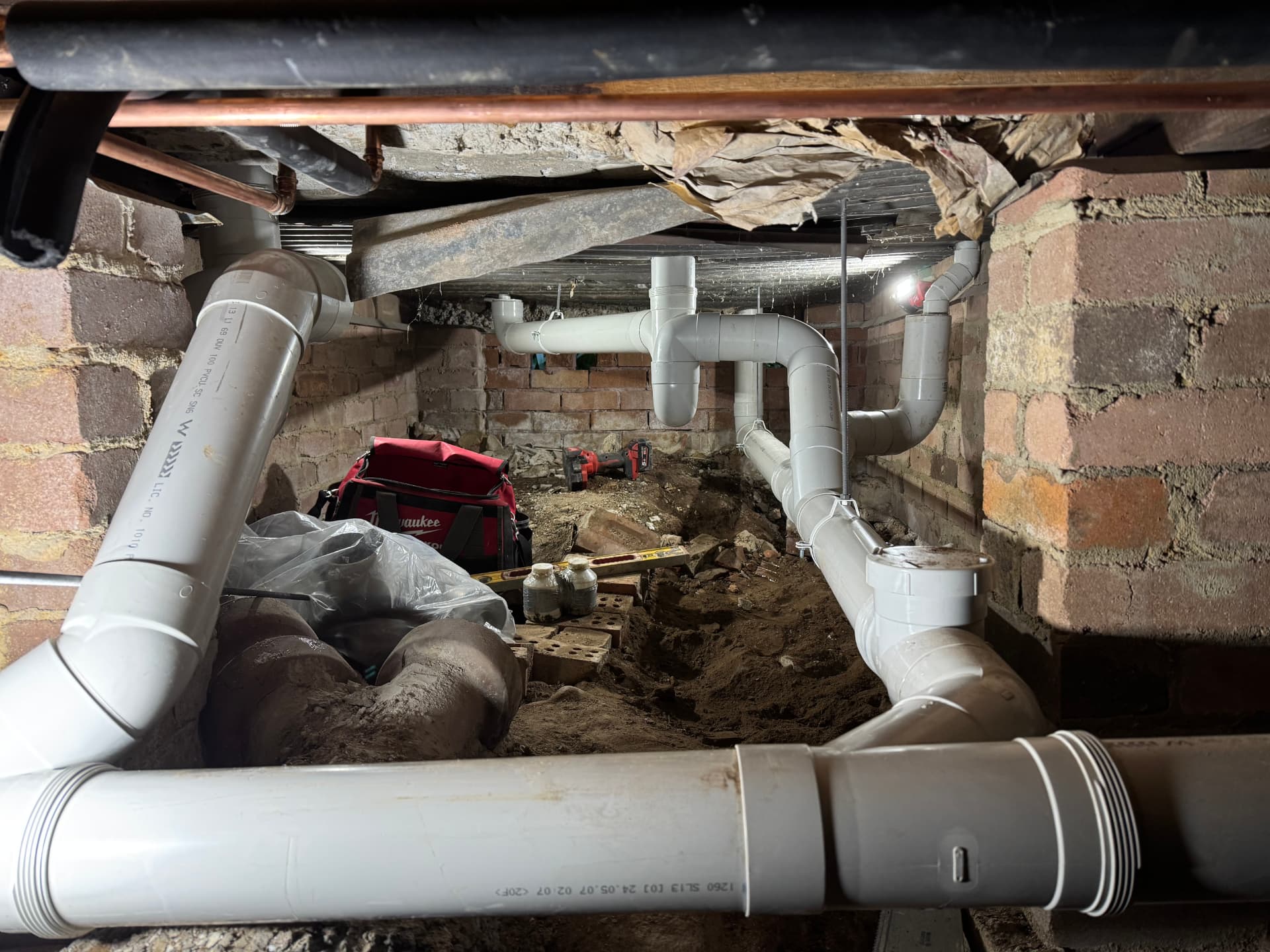 New sanitary drainage installed beneath a floor during construction works